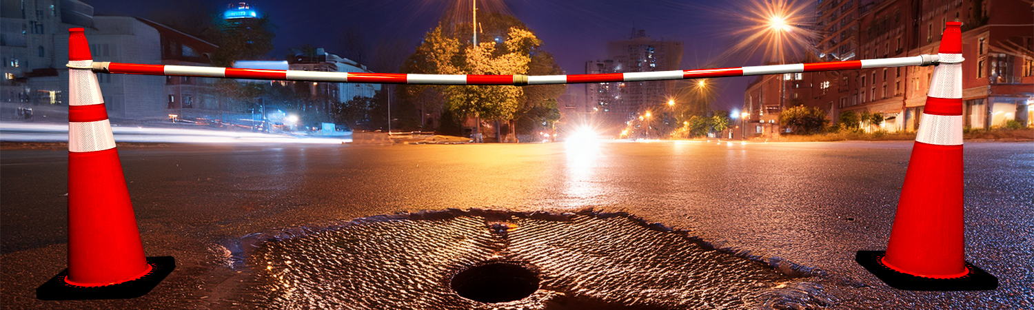 white orange hole in street night