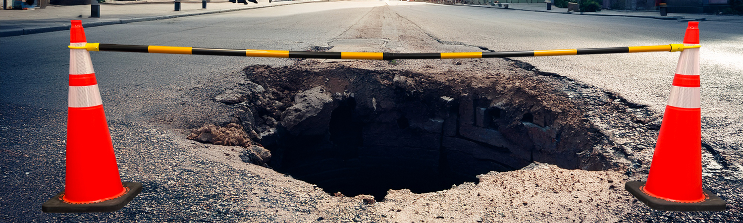 yellow black hole in street